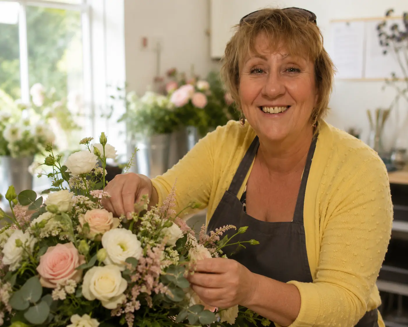 Jennifer Florence arranging flowers in her studio